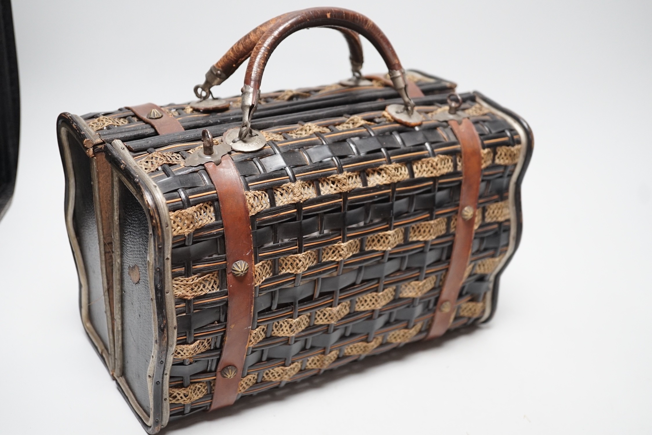 An unusual Edwardian straw and braided basket/bag, a French late 19th century basket with makers mark on metal mounts Berthelon, Macon, a small leather and velvet vanity case and contents and leather stationary case